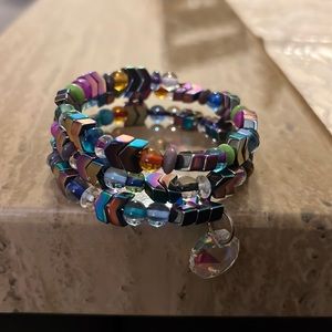 Multi color wrap bracelet with a charm